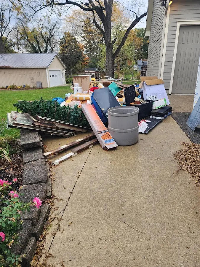 Dumpster being loaded with debris for 30 Yard Dumpster Rental in Oak Brook